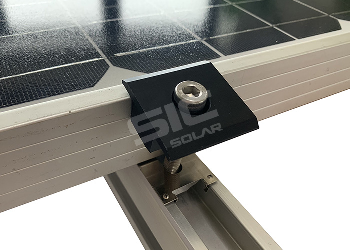 Solar panel grounding washers under mid clamps